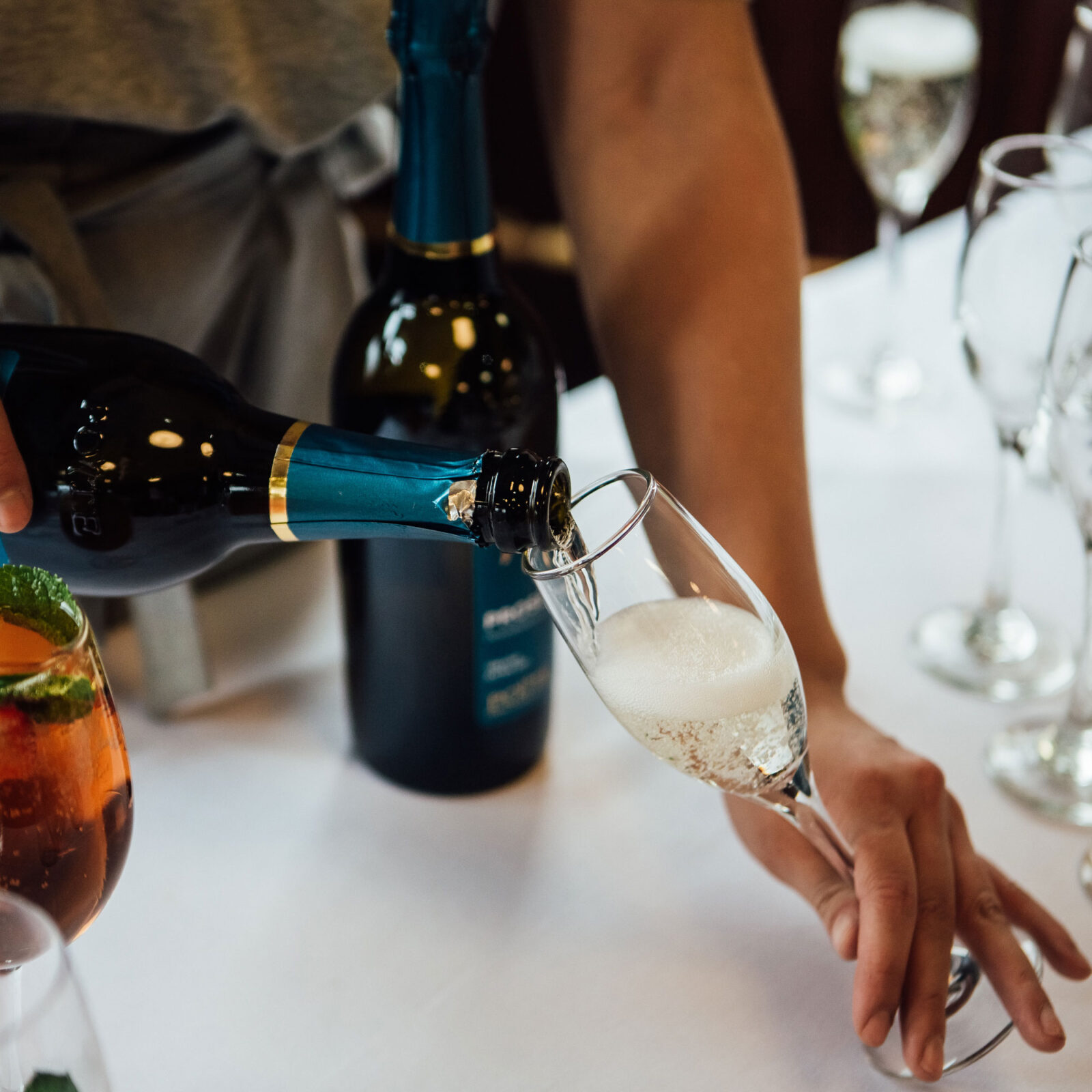 Drinks at The Tetley, prosecco being poured