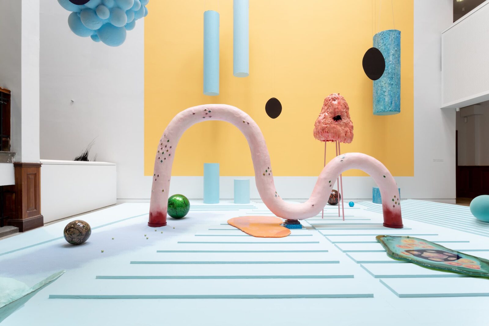 Installation view at The Tetley of Tai Shani's semiramis; the Atrium is pastel colours with large sculptures