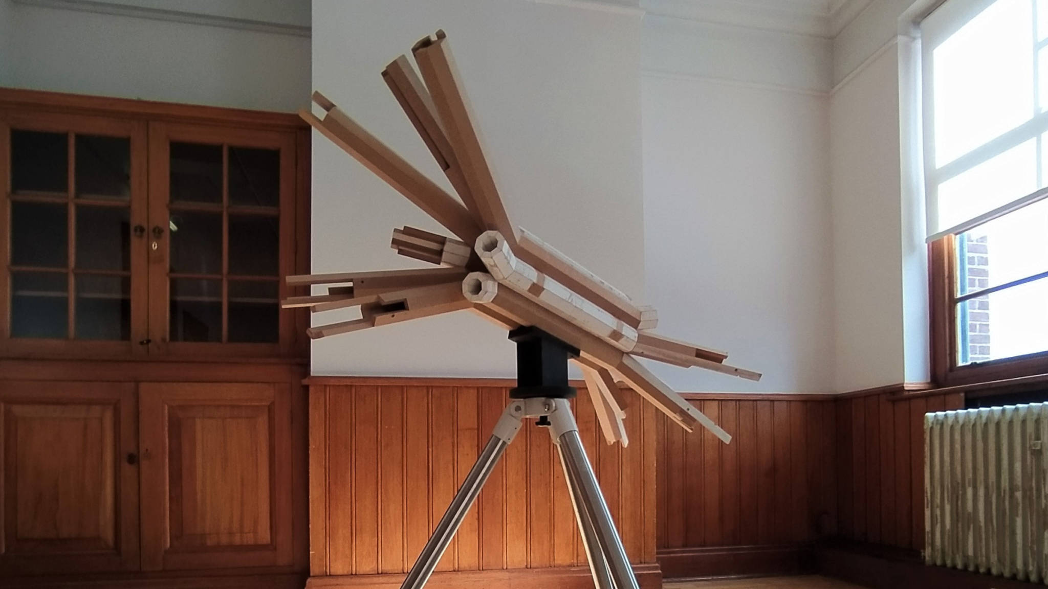 a photo of David Sowerby's work, including a surveyors tripod, mdf boards, gauze