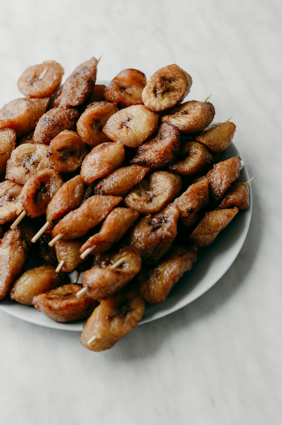 A plate of tasty fried plantain skewers