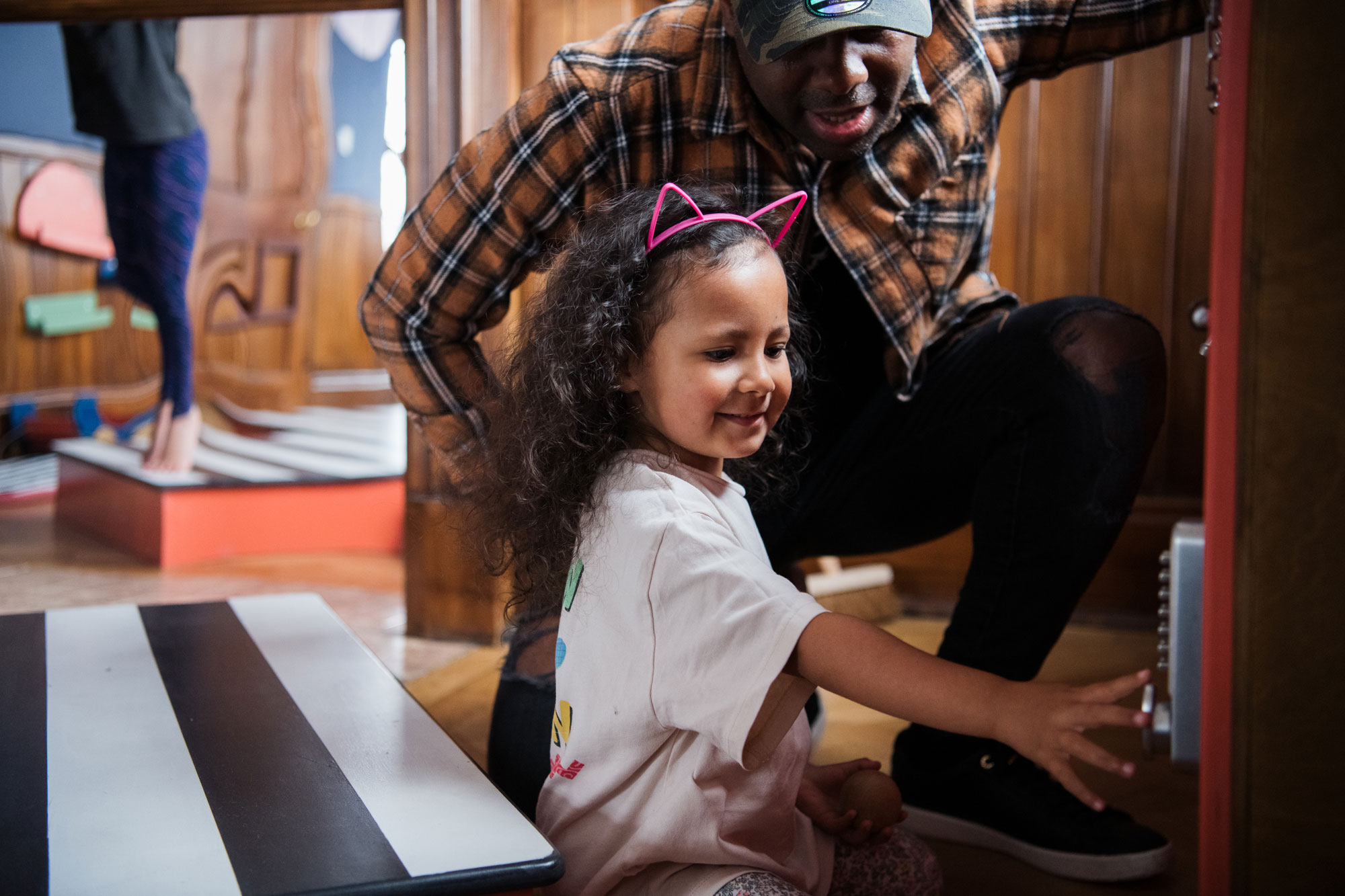 A parent with a child in Tiny Tetley Studio