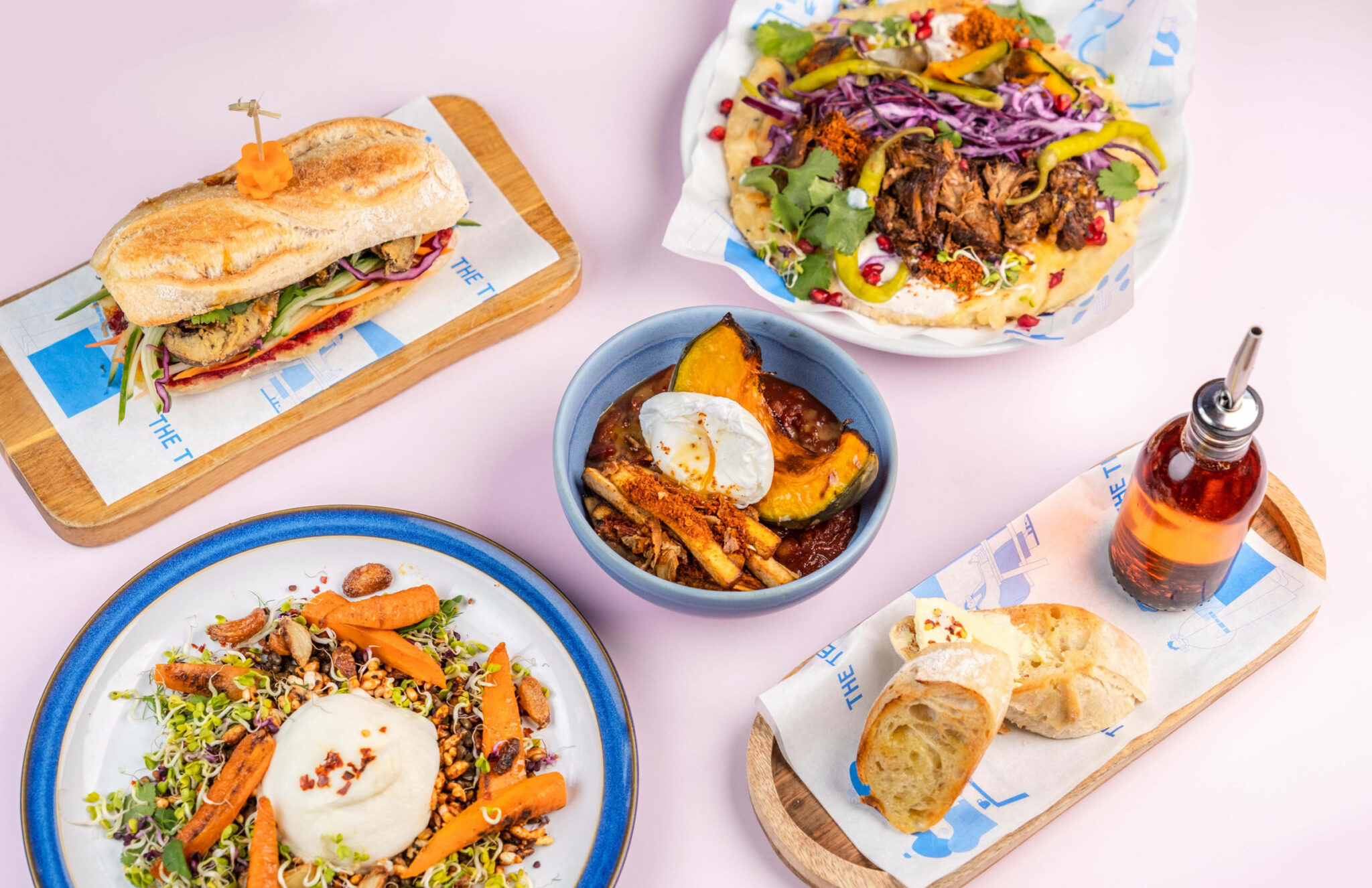 A salad, sandwich, lamb wrap and baked bean bowl