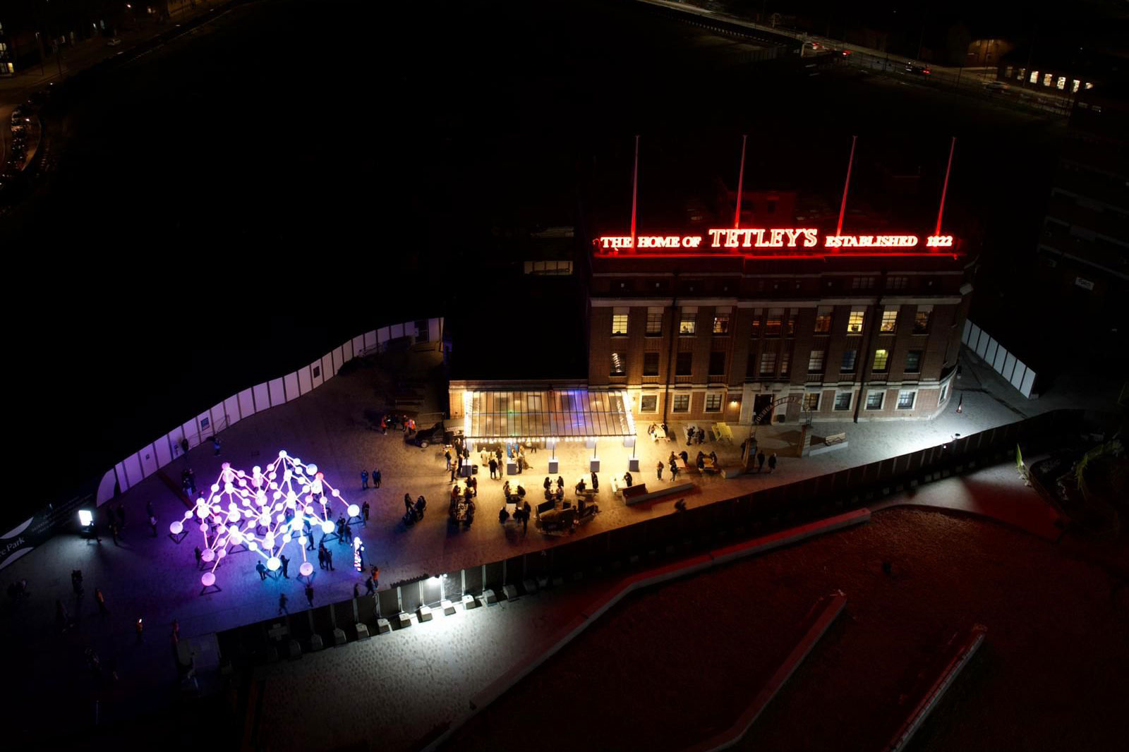 Drone shot of The Tetley during Light Night 2022. illuminated neon lights and illuminated sculpture