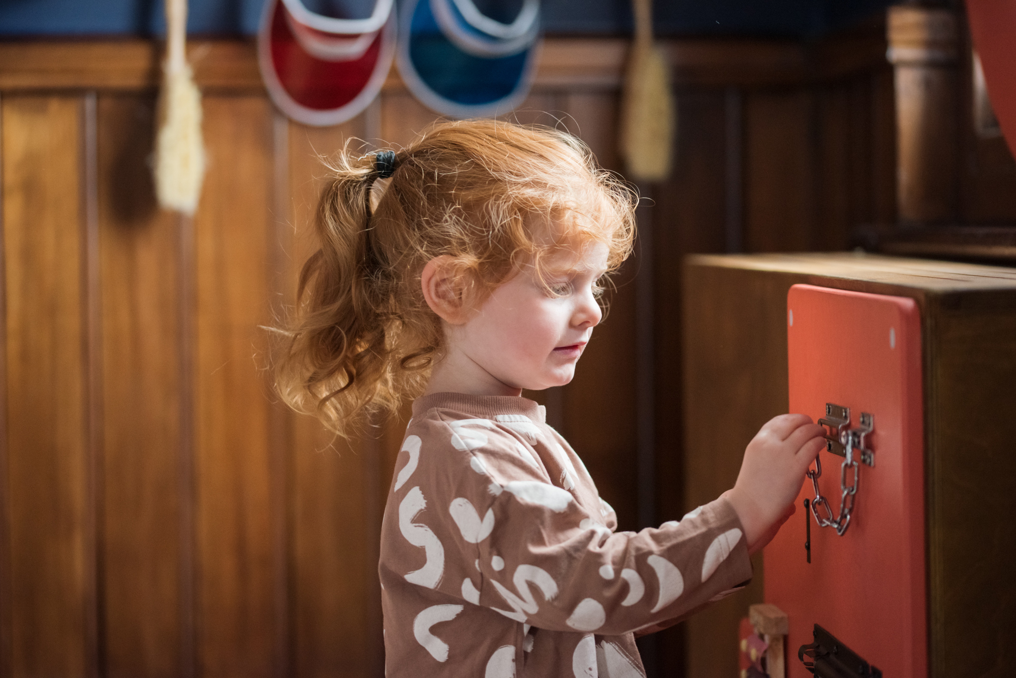 Young child plays with a toy