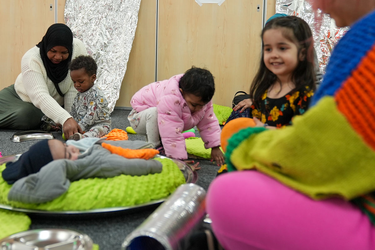 Children play in a colourful environment